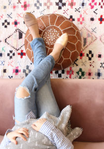 tan moroccan pouf in a nursery decor
