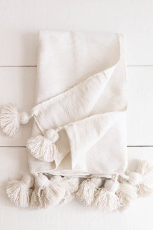moroccan pompom blankets available at Baba Souk
