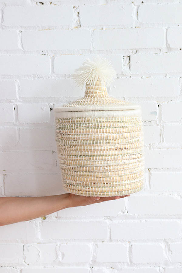 moroccan lidded basket with white pompom available at baba souk