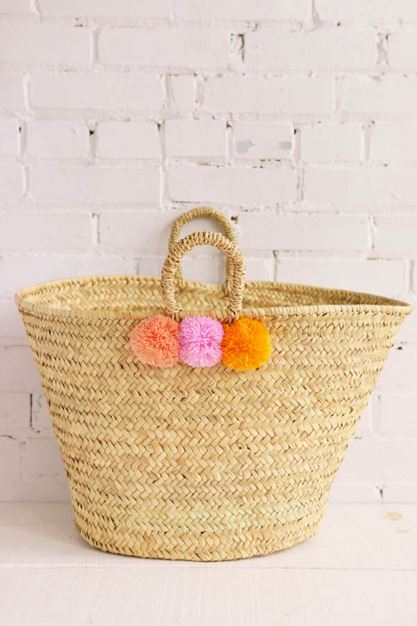 pompom basket handmade in morocco available at baba souk