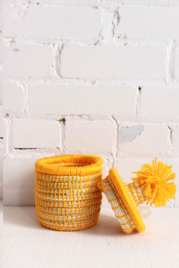 mini basket with pompom handmade in morocco available at baba souk