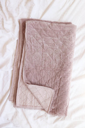 quilted velvet throw in lilac available at baba souk