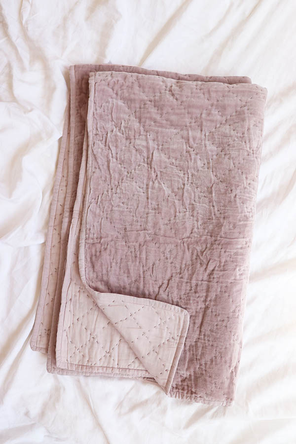 quilted velvet throw in lilac available at baba souk
