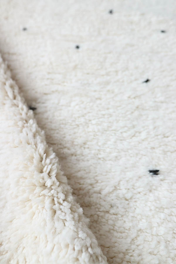 white rug with black dots wool carpets, baba souk