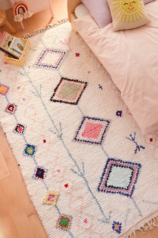 colourful cotton rugs in a kids bedroom